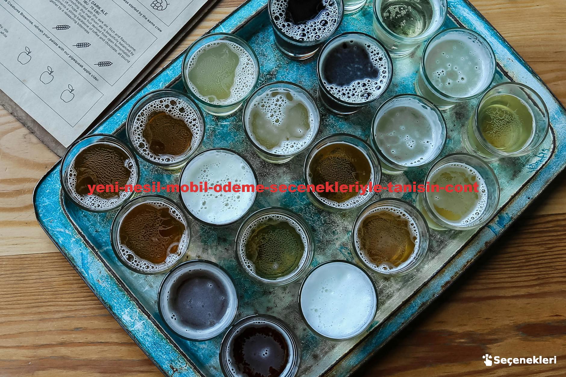 Aerial view of assorted beer glasses on a rustic tray, perfect for brewery tasting sessions.