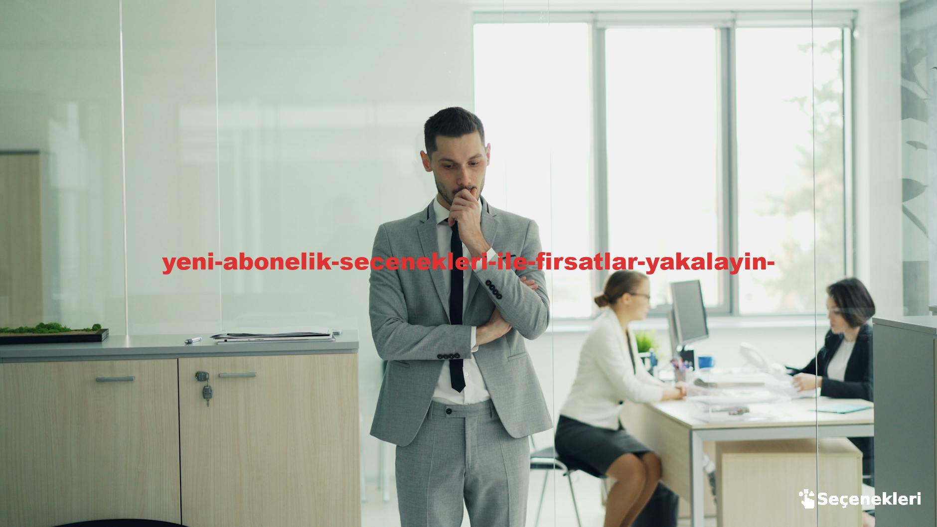 Thoughtful businessman in a modern office setting with colleagues working in the background.
