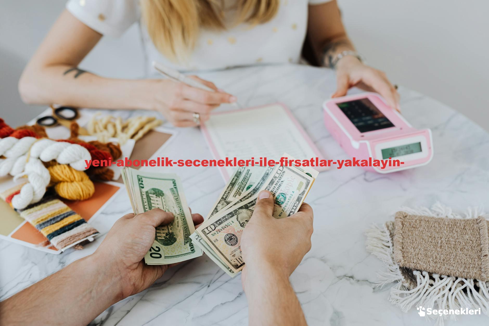 Two people handling cash and budgeting with a calculator and notebook at a table.