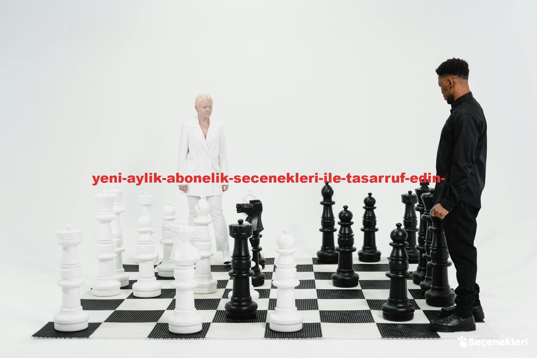 Two people engaged in a strategic chess game with oversized black and white pieces.